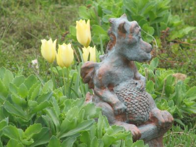 Happy Dragon on pedestal with copper patina