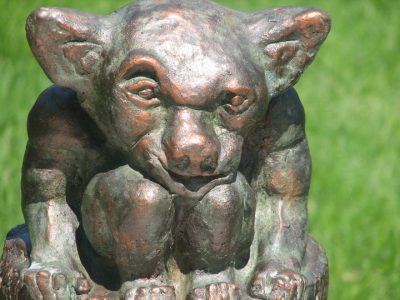Gargoyle on stump with copper patina